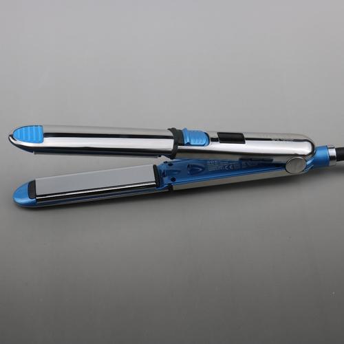 Professional hair straightener in salon use