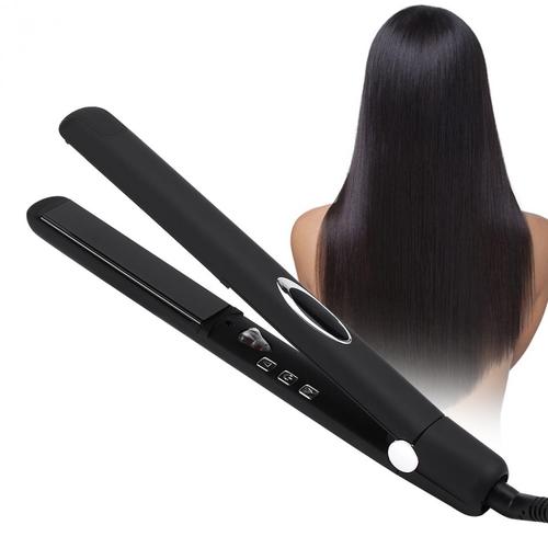 Professional hairstylist using hair crimper on model