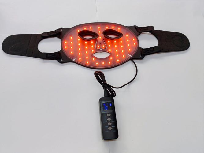 Professional using Light Therapy Skincare Silicone Mask in spa setting