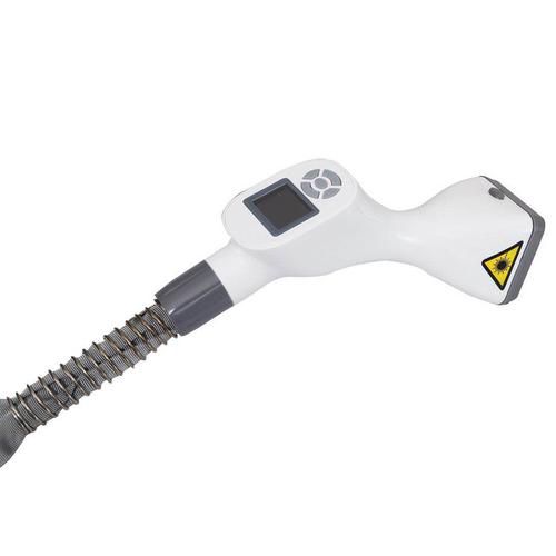 Professional using face lifting massager in clinic