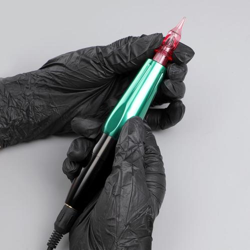 Professional tattoo artist using best needle cartridges