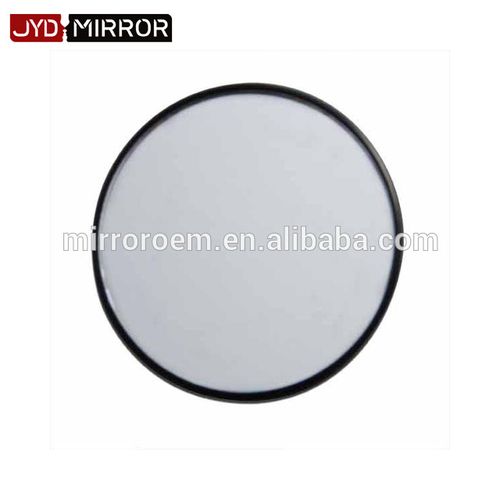 Professional makeup application with round magnifying mirror
