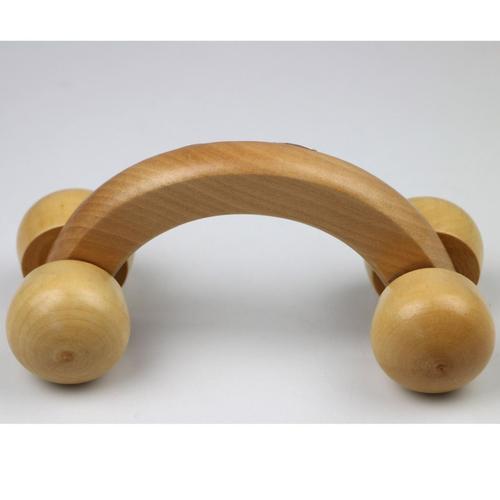 Professional using handheld body massager on shoulder