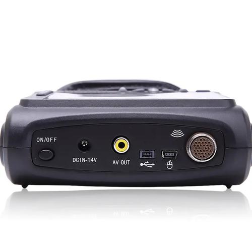 Medical professional using handheld ultrasound machine in clinic