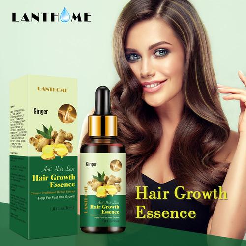 woman using hair growth device at home