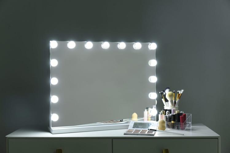 Professional makeup application with lighted makeup mirror