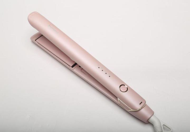 Professional using infrared steam hair straightener