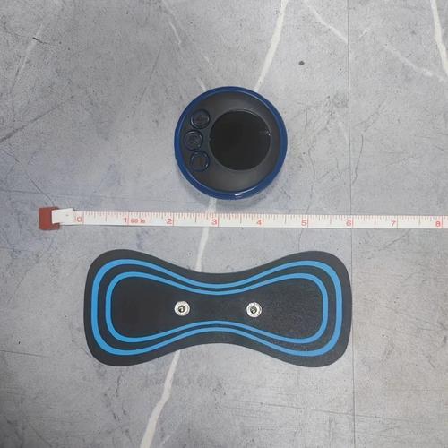 Professional using EMS neck massager in clinical setting